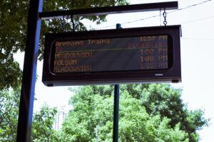 LED platform sign listing arriving trains at a Sacramento Regional Transit light rail station