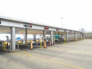 LED lane signs across the exit plaza payment lanes at Memphis International Airport