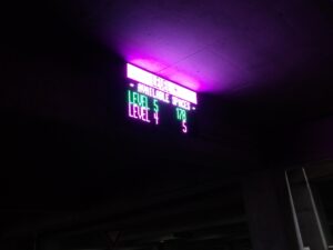 IPLED-96X144-RGB-6.67-ODX-FS full-colour LED sign showing per-level parking availability in the Memphis International Airport economy garage
