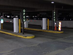 Portrait-orientation IPLED-96X48-RGB-6.67-ODX-FS lane signs marking open entry lanes at the Memphis International Airport garage
