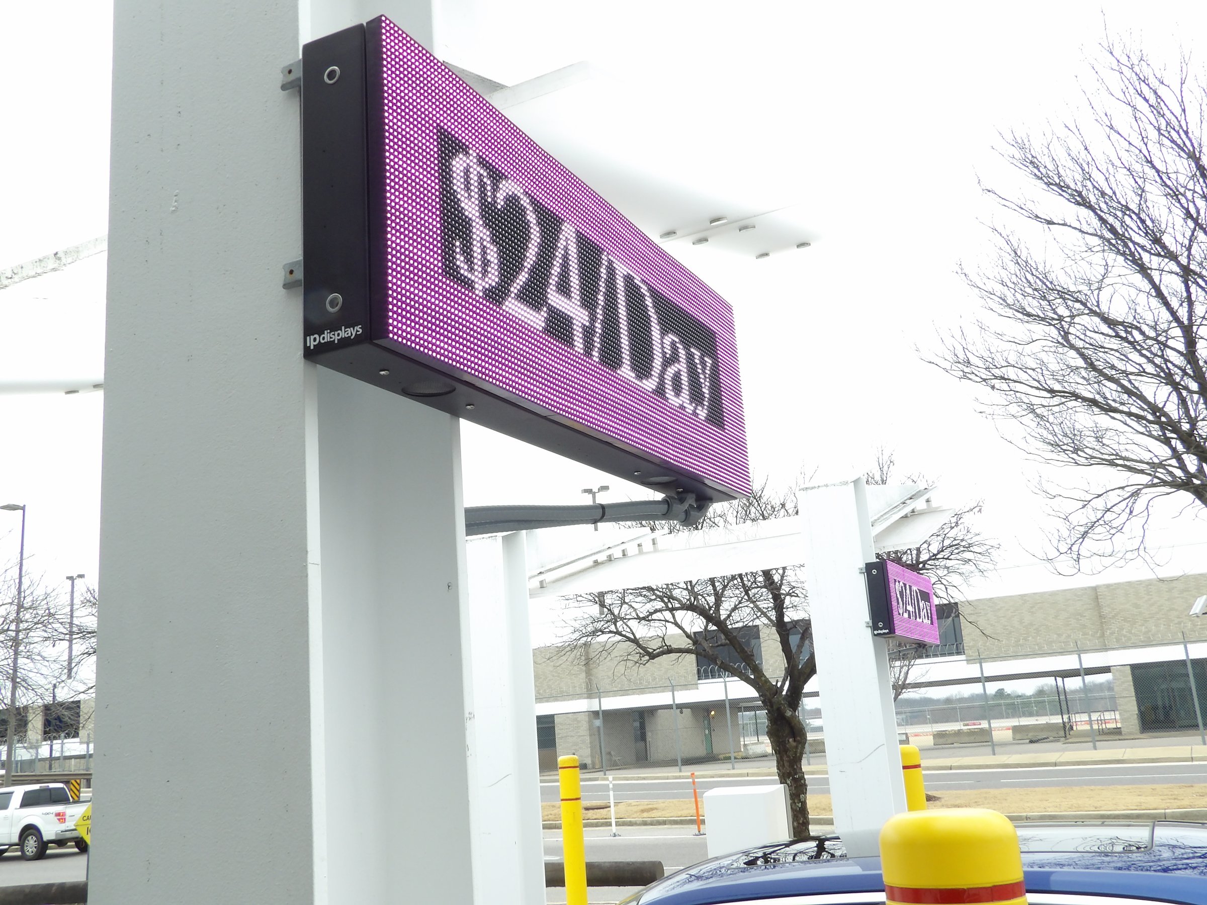 Close-up of a full-colour LED parking rate sign displaying a daily rate at the Memphis International Airport short-term garage