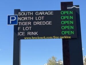 LED parking availability sign in Breckenridge, Colorado showing South Garage, North Lot, Tiger Dredge, F Lot and Ice Rink all open