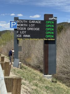 Close-up of the Breckenridge parking availability sign with five lots marked open in green