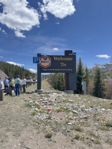 Breckenridge monument sign displaying a welcome message alongside the BreckPark free-parking branding