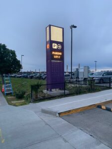 Amber LED parking pylon sign marking Lot C at the Cross Border Xpress terminal