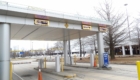 Amber LED lane signs under the long-term parking entry canopy at Memphis International Airport showing entry lanes and the daily rate