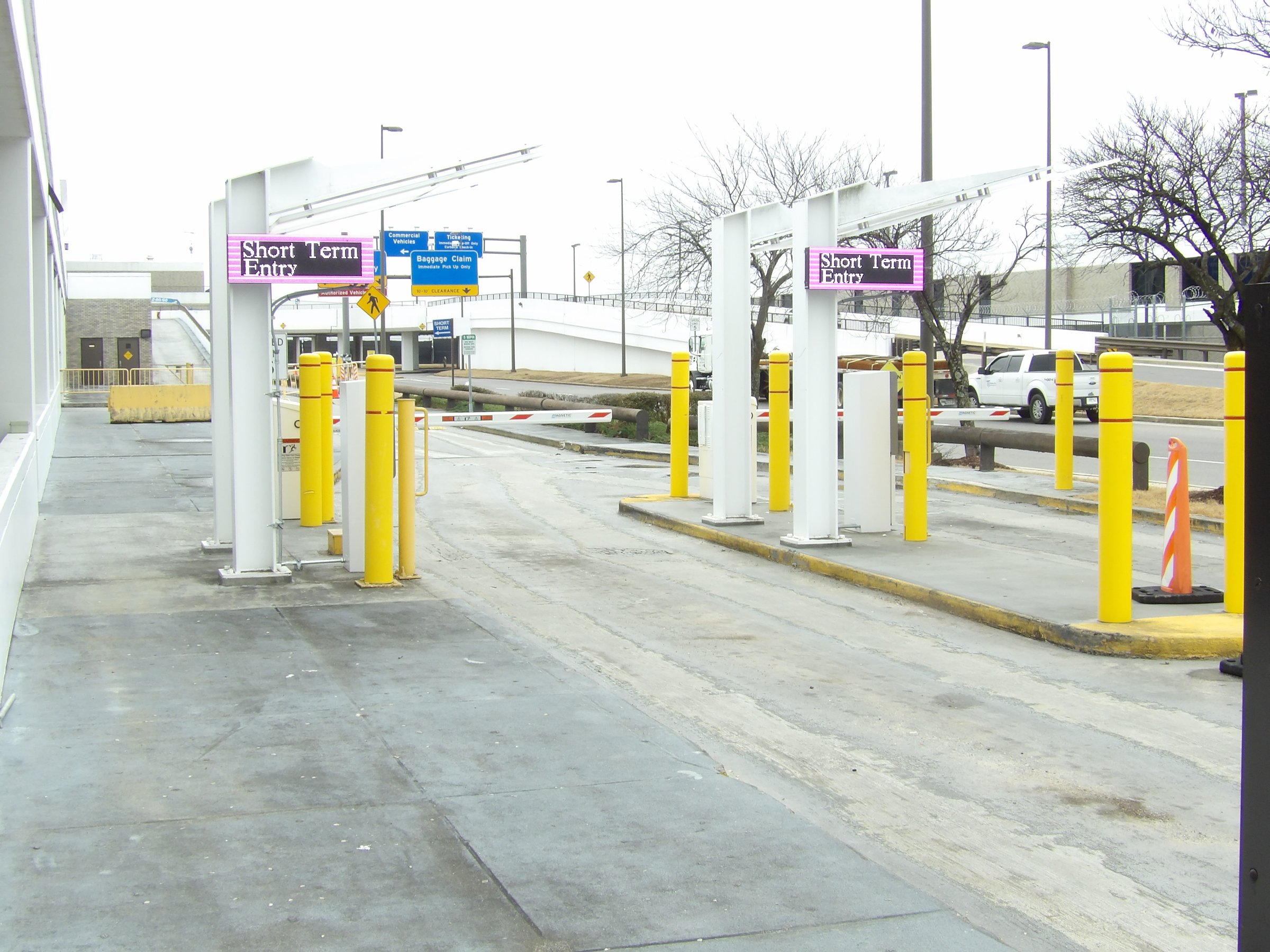Magenta LED Short Term Entry signs marking the entry lanes at Memphis International Airport